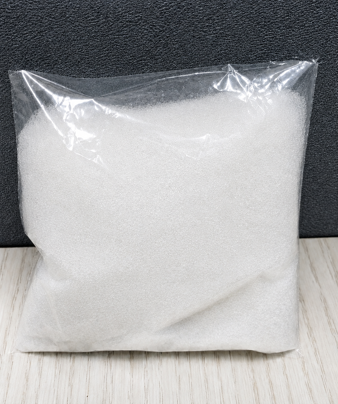 Pure off white crystalline extract powder inside a transparent plastic pouch